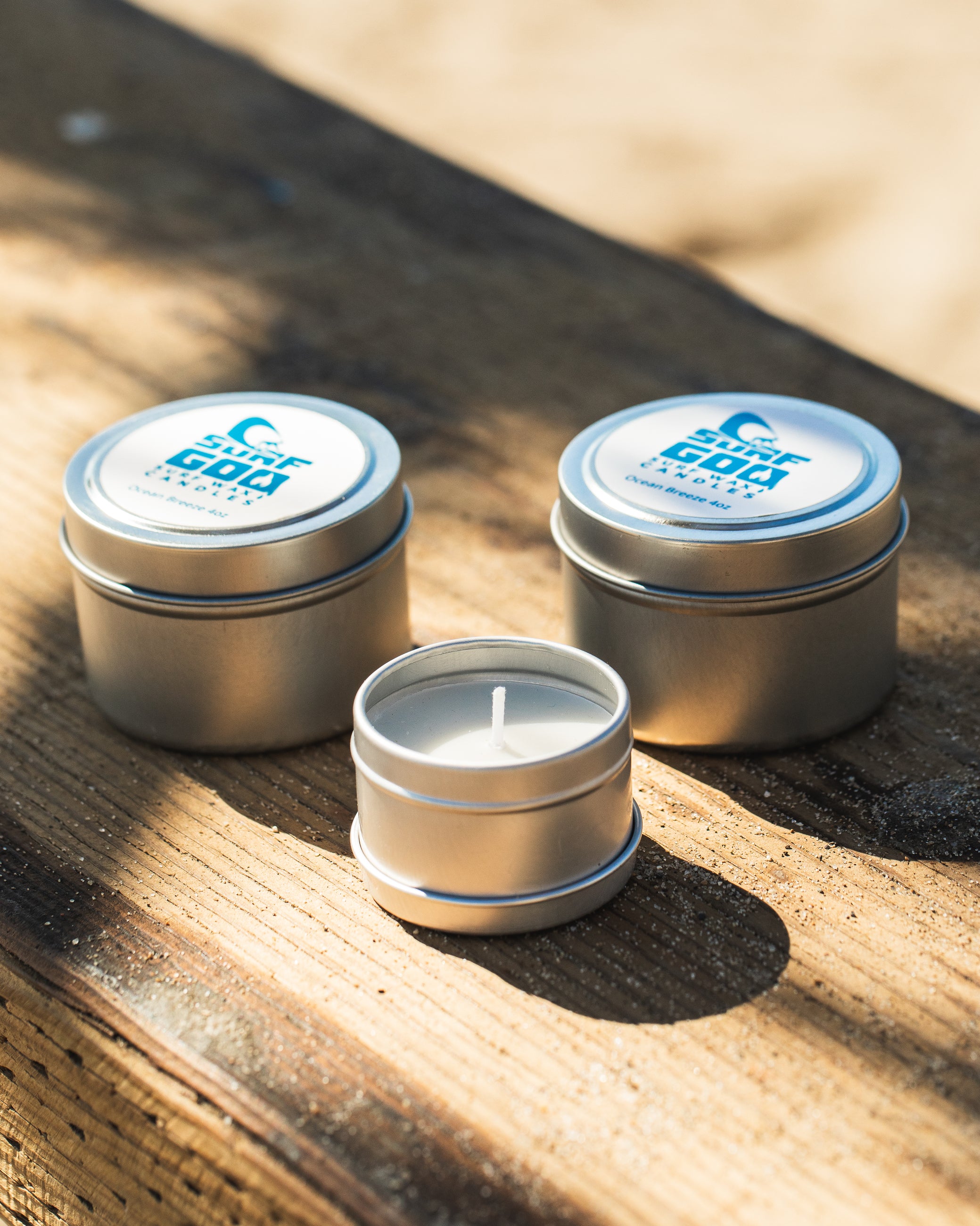 Luxury scented candle in glass jar with warm glowing light – hand-poured soy wax.